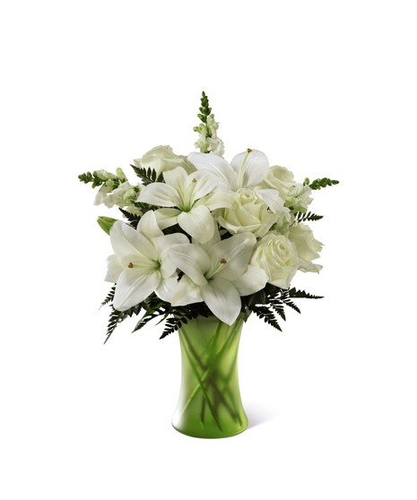 white flowers in simple matte green vase