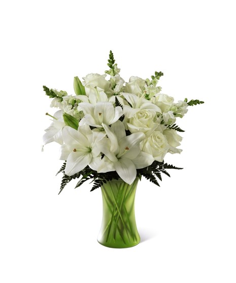 white flowers in simple matte green vase