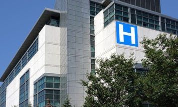 A hospital building with a prominent 